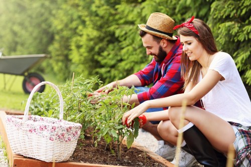 Gardeners with tools and green waste bags in Barking